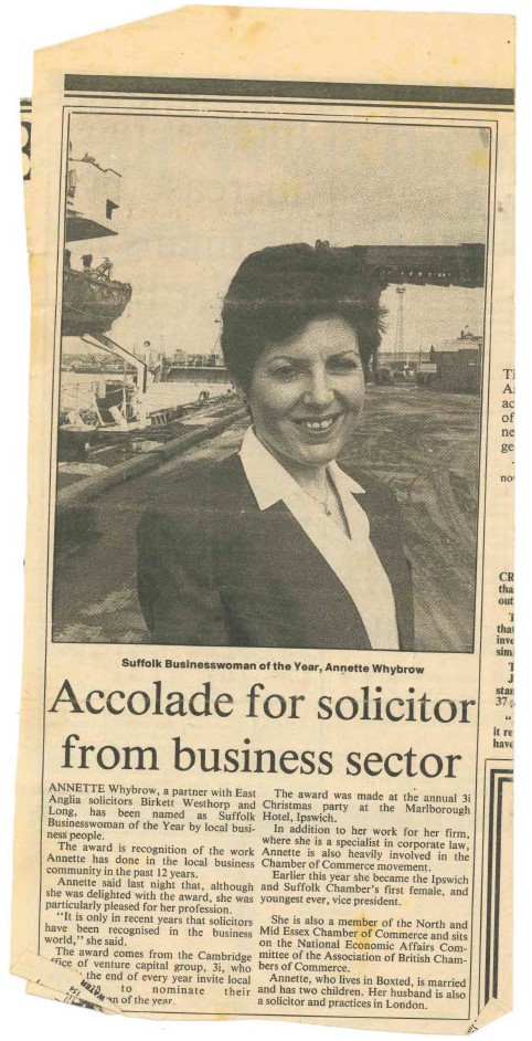 An old, yellow newspaper clipping from the 1990s. The title reads "Accolade for solicitor from business sector". There is a black and white photograph of a white woman, Annette, in business dress.