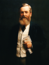 A coloured portrait of a light-skinned man with a beard. He is wearing a suit, and holding a newspaper.