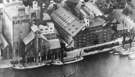 An aerial black and white photograph of factories on the Ipswich docks