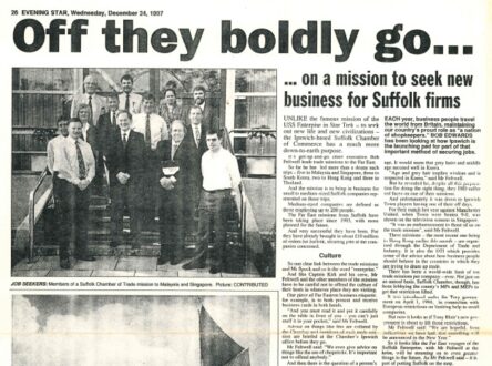 Old newspaper print article with photos and text