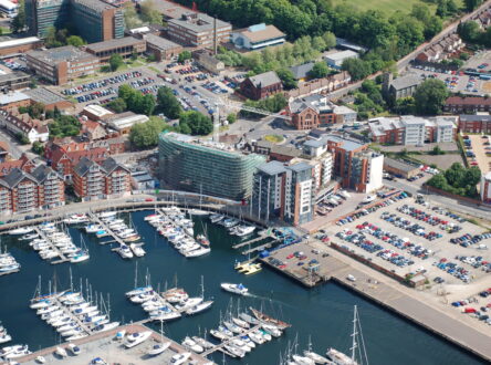 An aerial photograph of the Ipswich waterfront and docks, with the university being built in the centre.