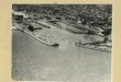 Black and white aerial photograph of a harbour.