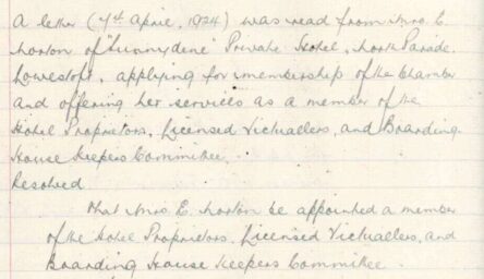 An old handwritten minute book.