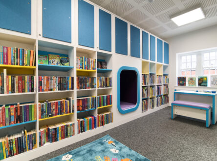 A library, with books on the shelves.